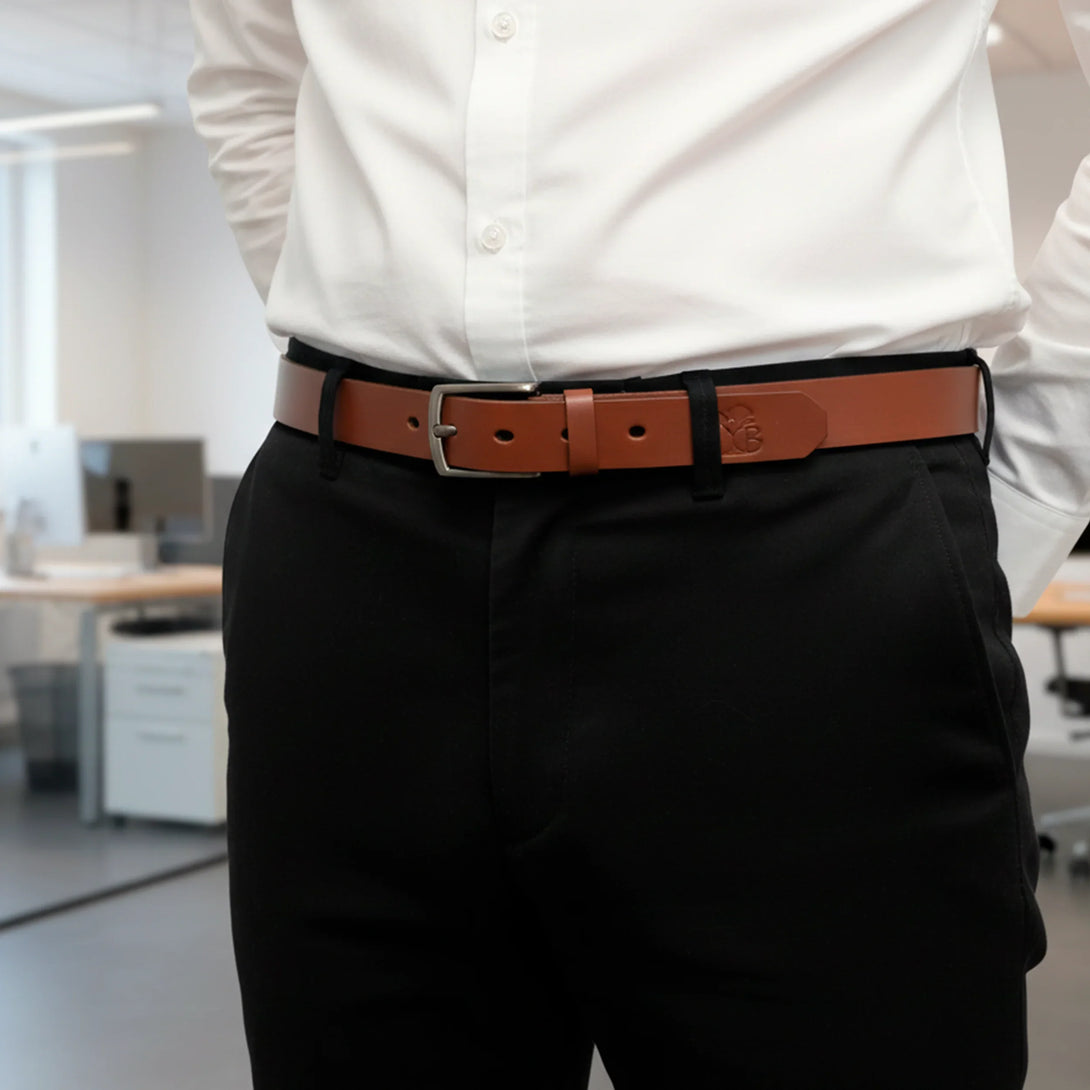 Personalized brown leather belt worn with black pants and white shirt for men